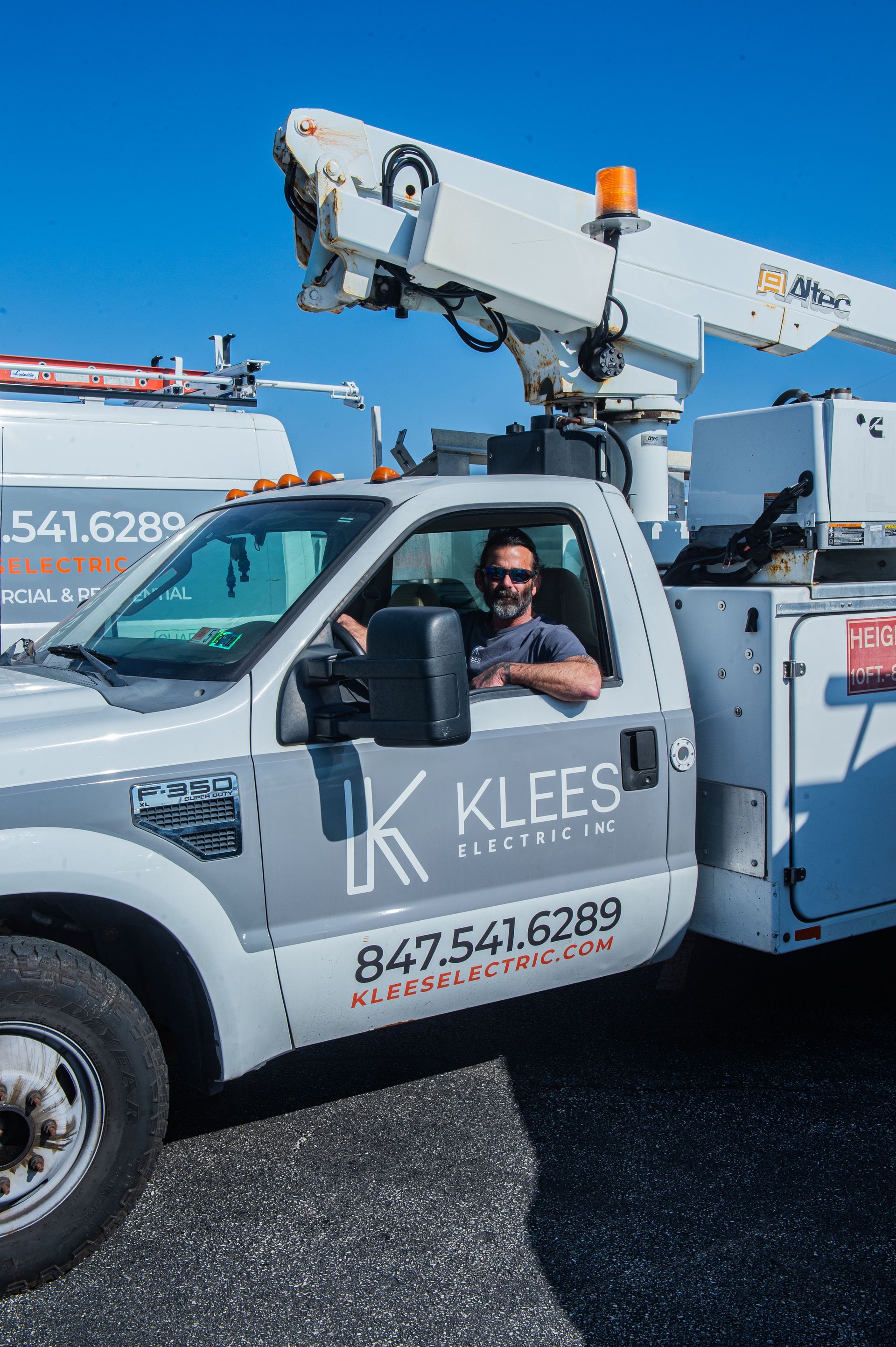 A van with a ladder on top of it
