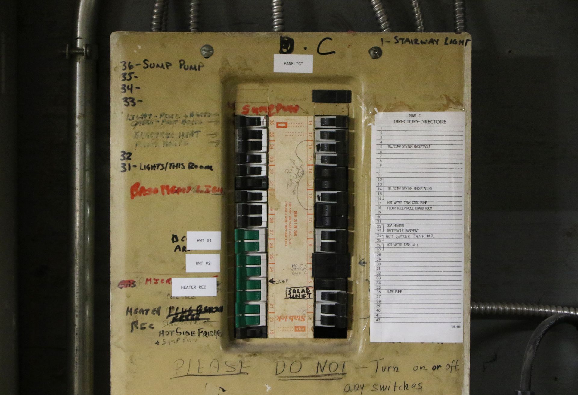 Outdated Zinsco or Federal Pacific electrical panel inside a multifamily property in Illinois.