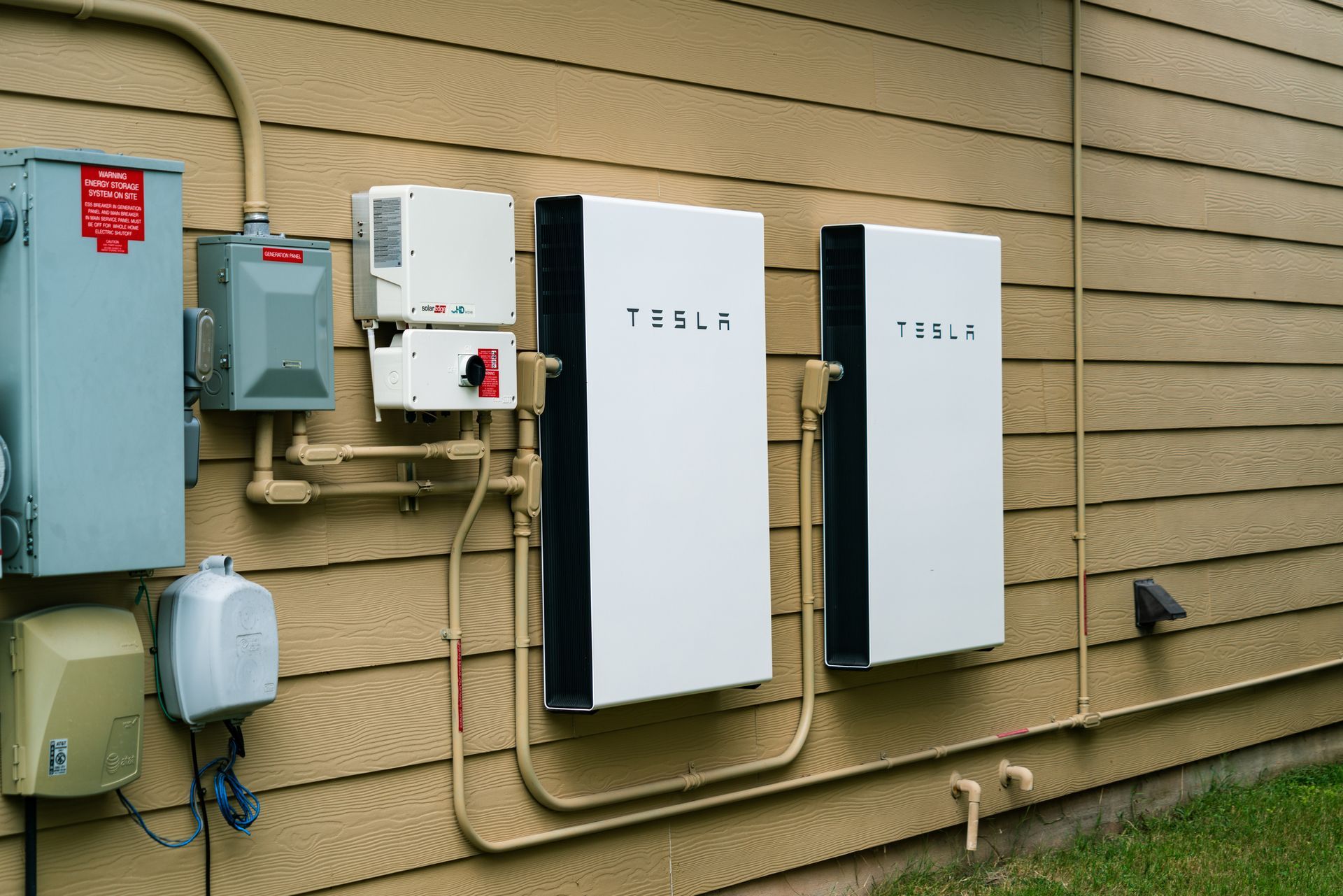 A Tesla Powerwall installed on the wall of a modern home in Buffalo Grove, showcasing its sleek desi