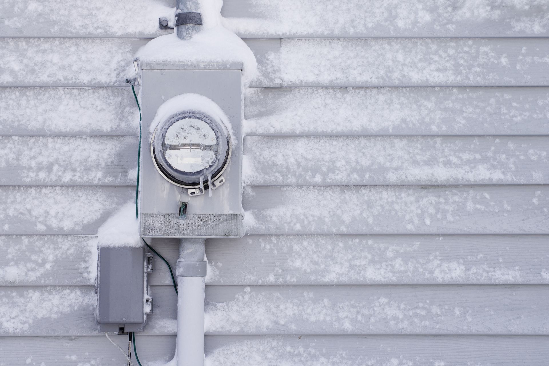 Electrical panel covered in snow in Buffalo Grove.