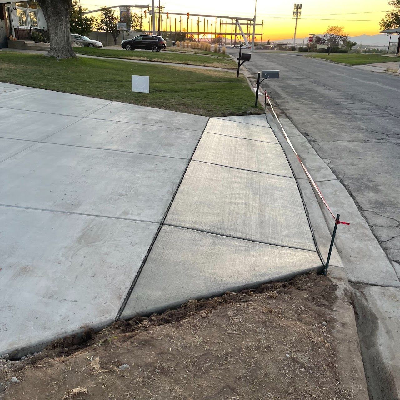 A sidewalk is being built on the side of a road