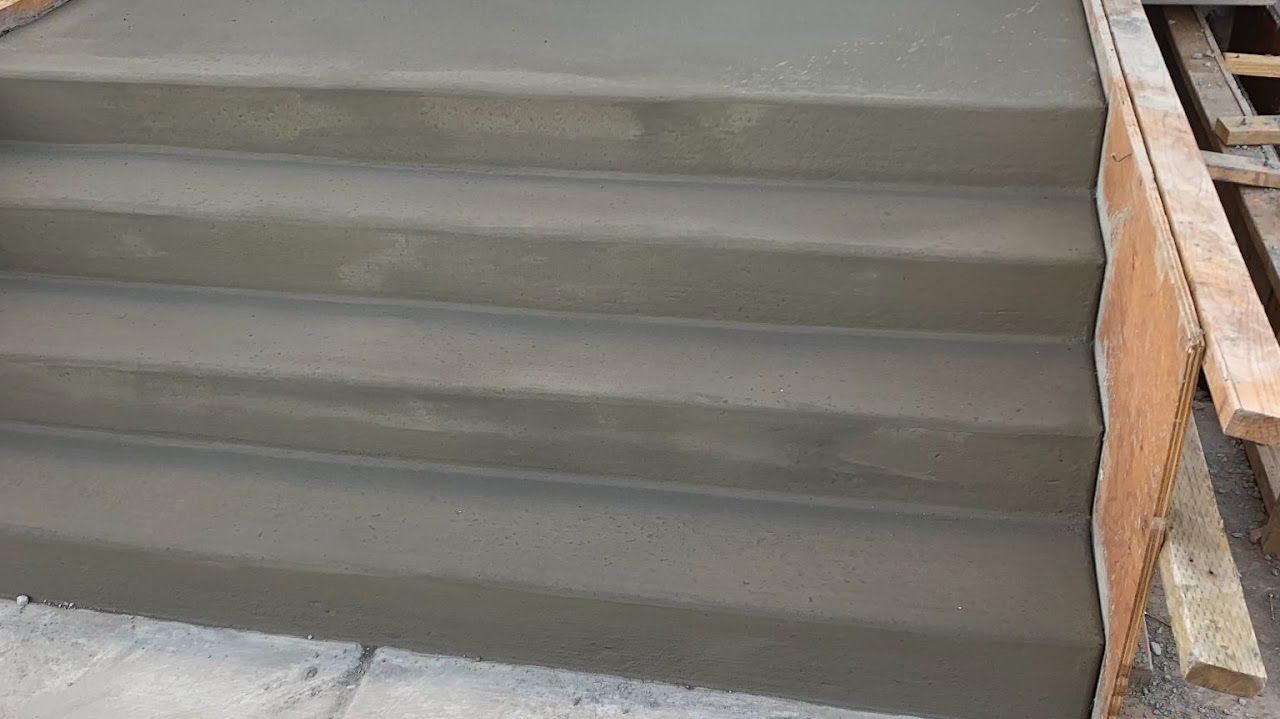 A close up of a set of concrete stairs being built.