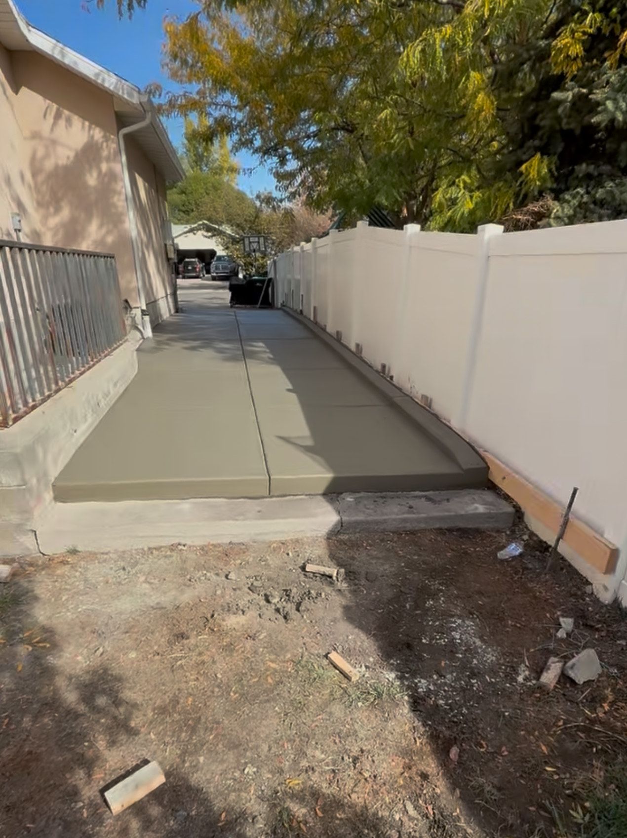 A house with a lot of rocks and gravel in front of it.