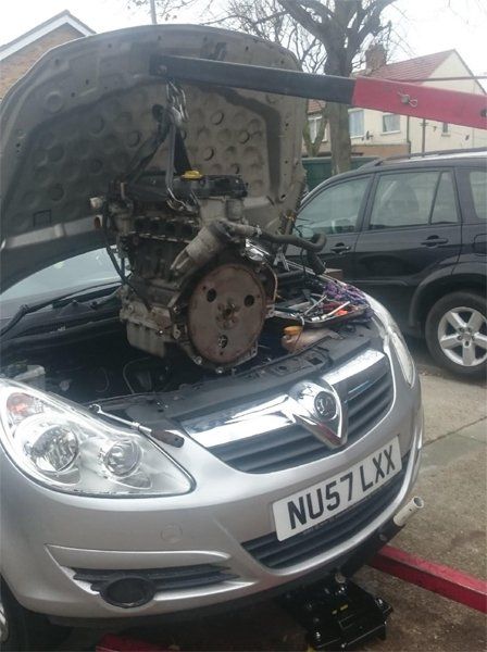 Inside of an engine that is being repaired, a Vauxhall Corsa