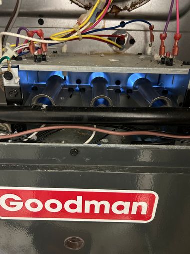 repairing a goodman gas furnace and checking the burners for proper combustion