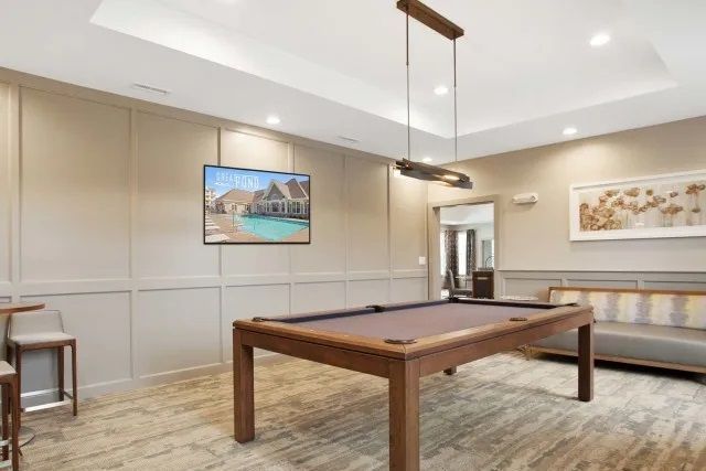 The Residences At Great Pond apartment community entertainment lounge with billiard.