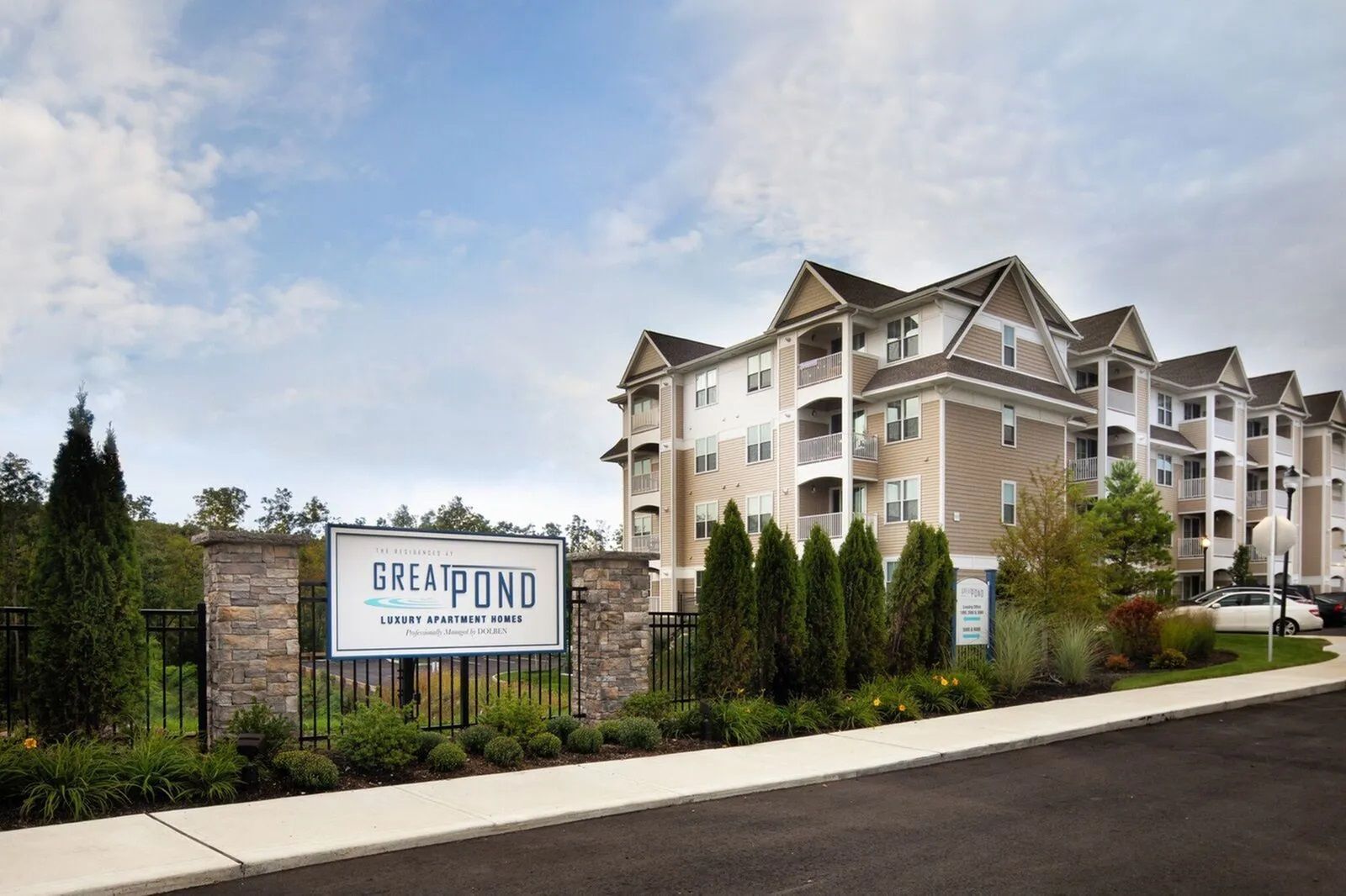 The Residences At Great Pond apartment entrance with signage.