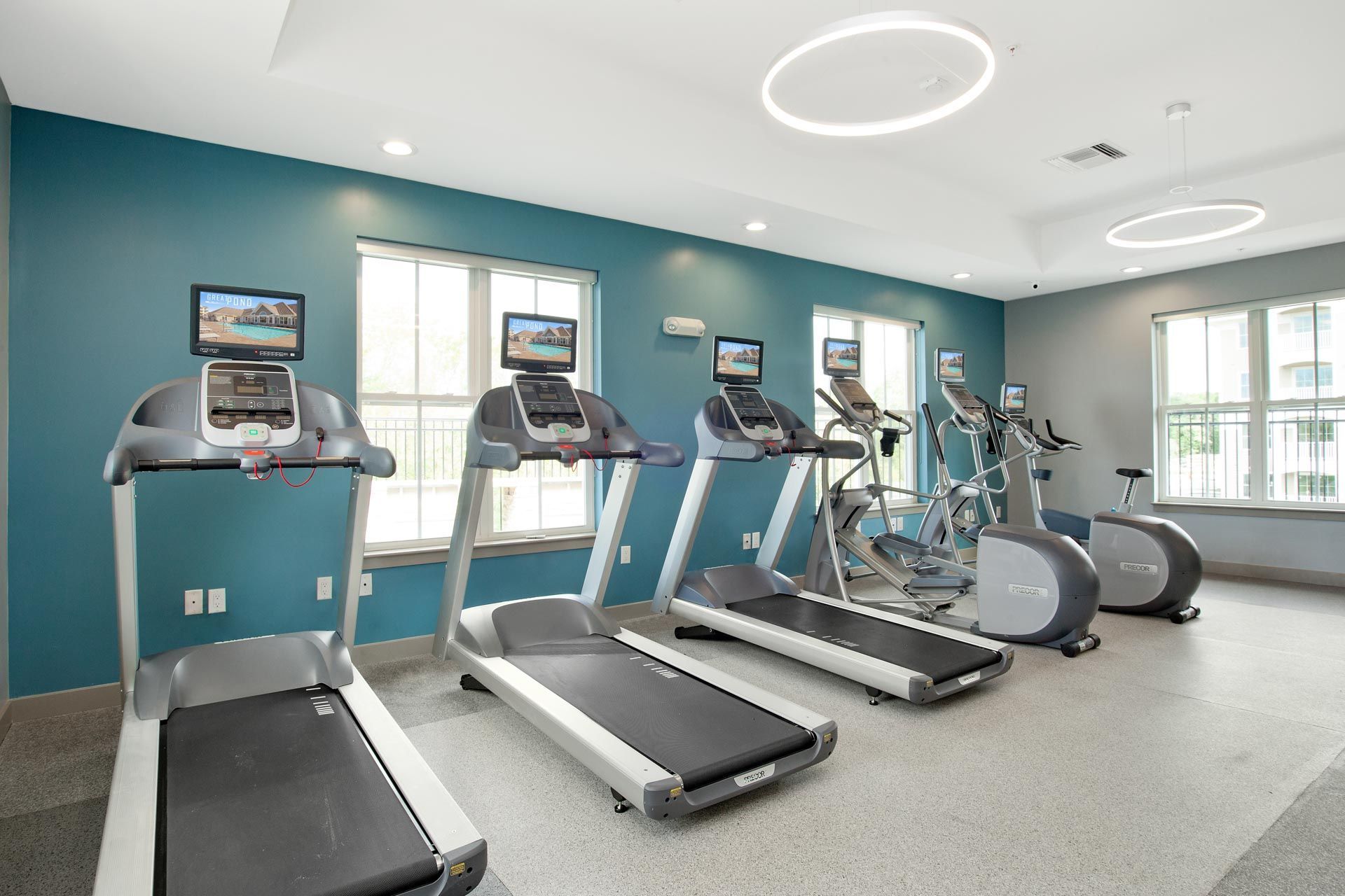 The Residences At Great Pond apartment community fitness center with machines.