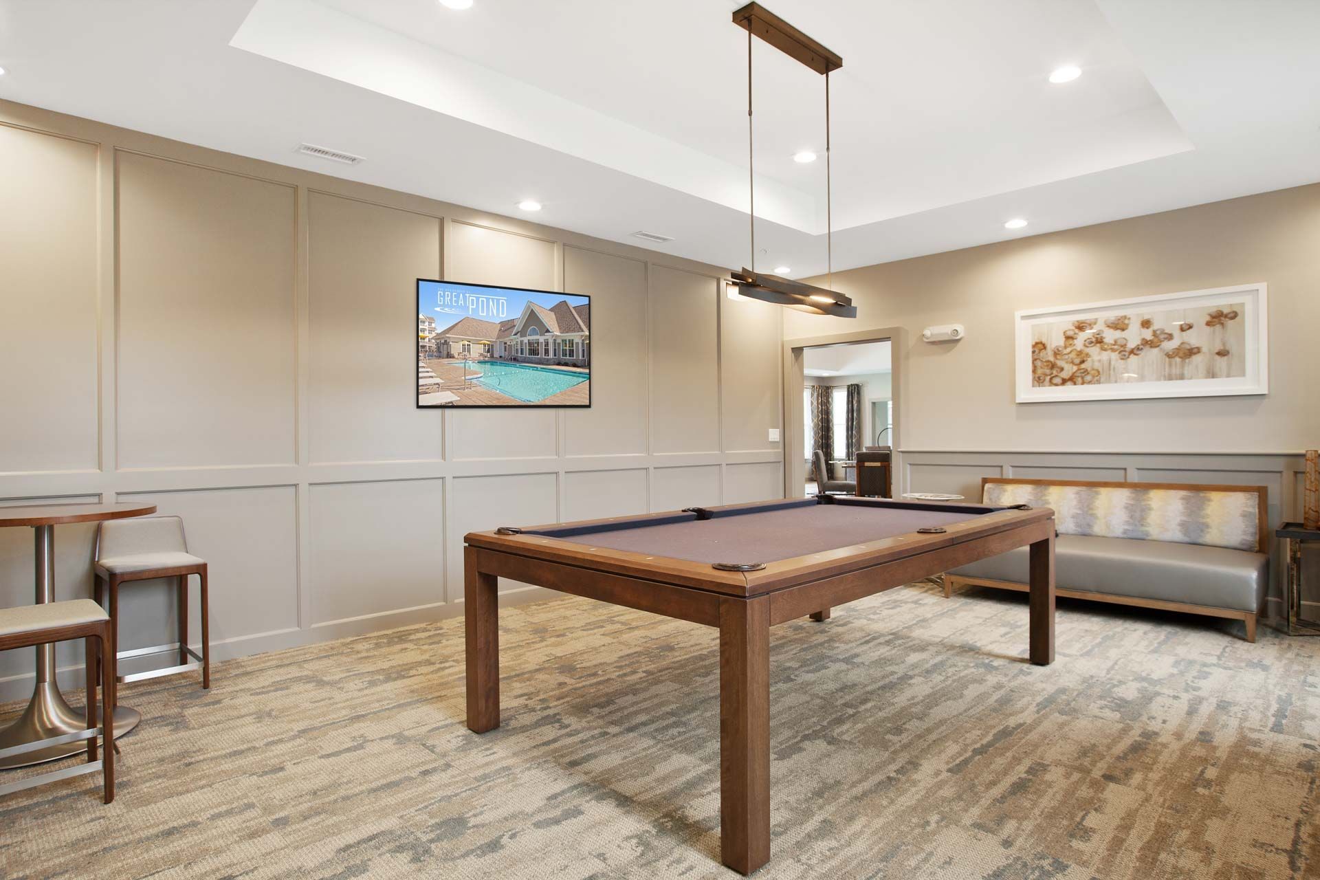 The Residences At Great Pond apartment community entertainment lounge with billiard.