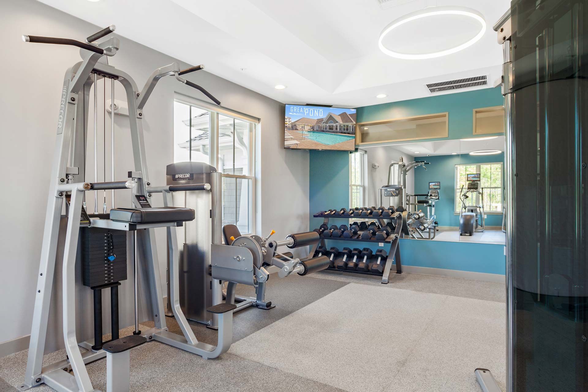 The Residences At Great Pond gym with weights.