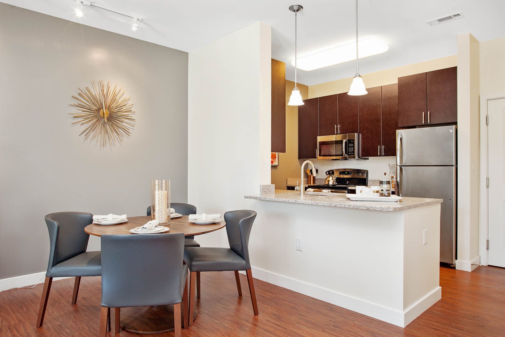 The Residences At Great Pond apartment kitchen and dining room.