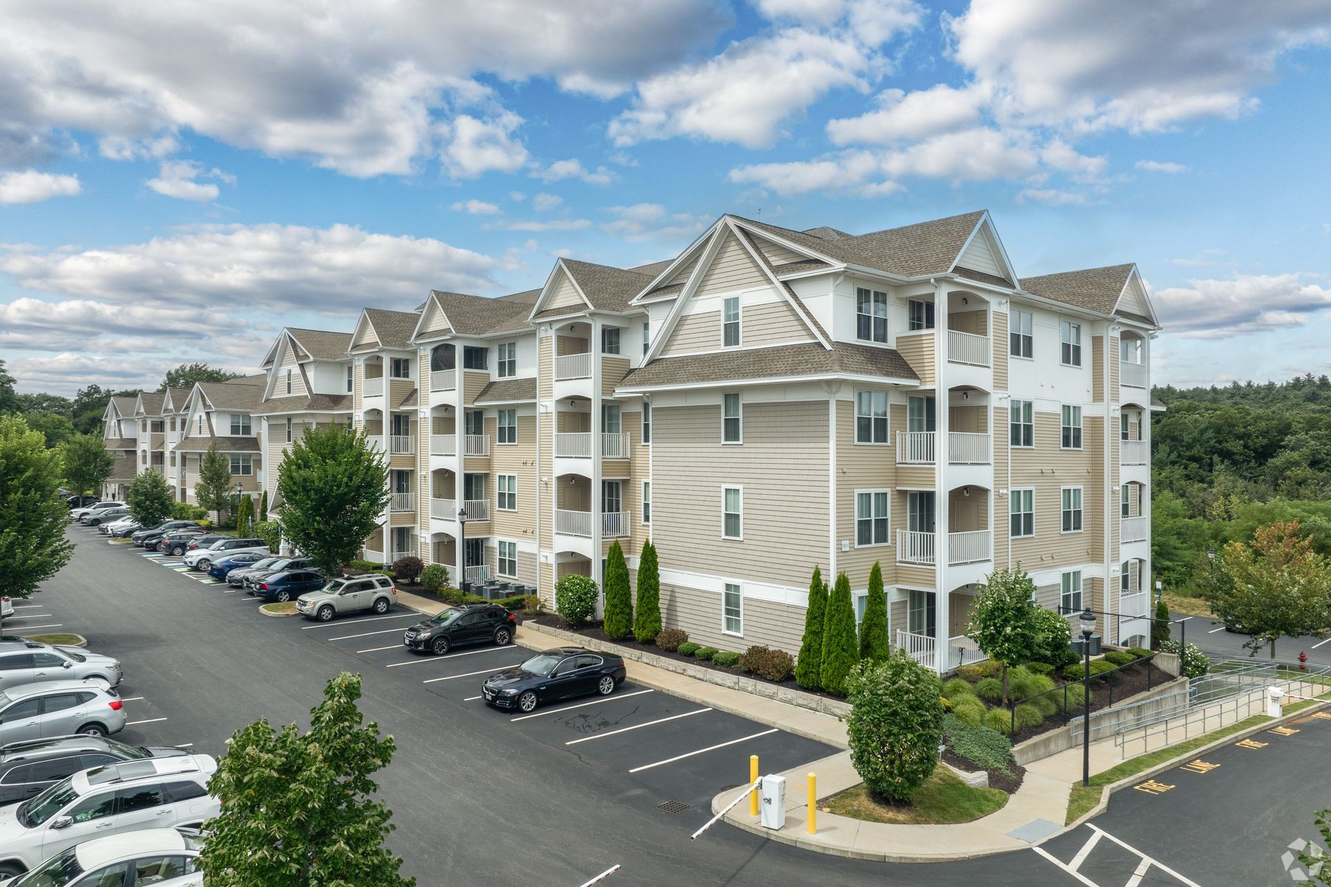 The Residences At Great Pond apartment building exterior view.