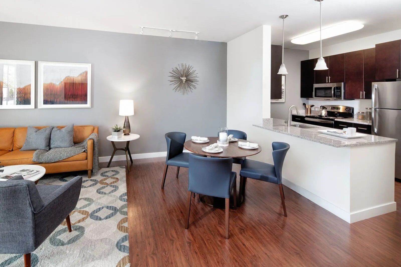 The Residences at Great Pond open floor plan layout with kitchen, dining area, and living room.