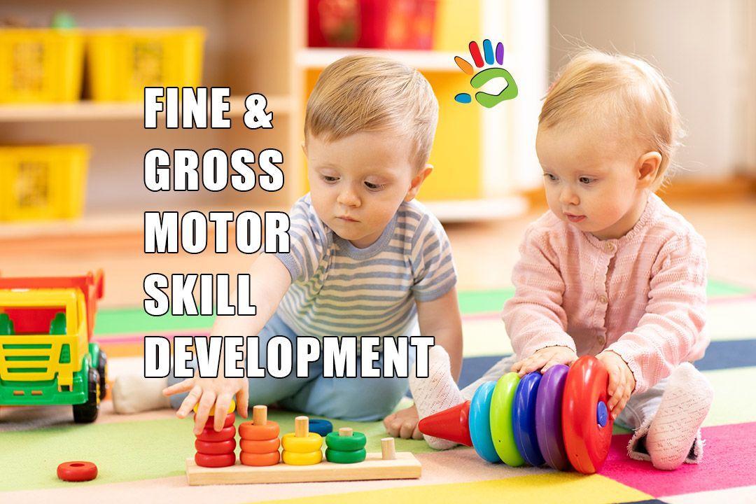 Two babies are playing with toys on the floor.