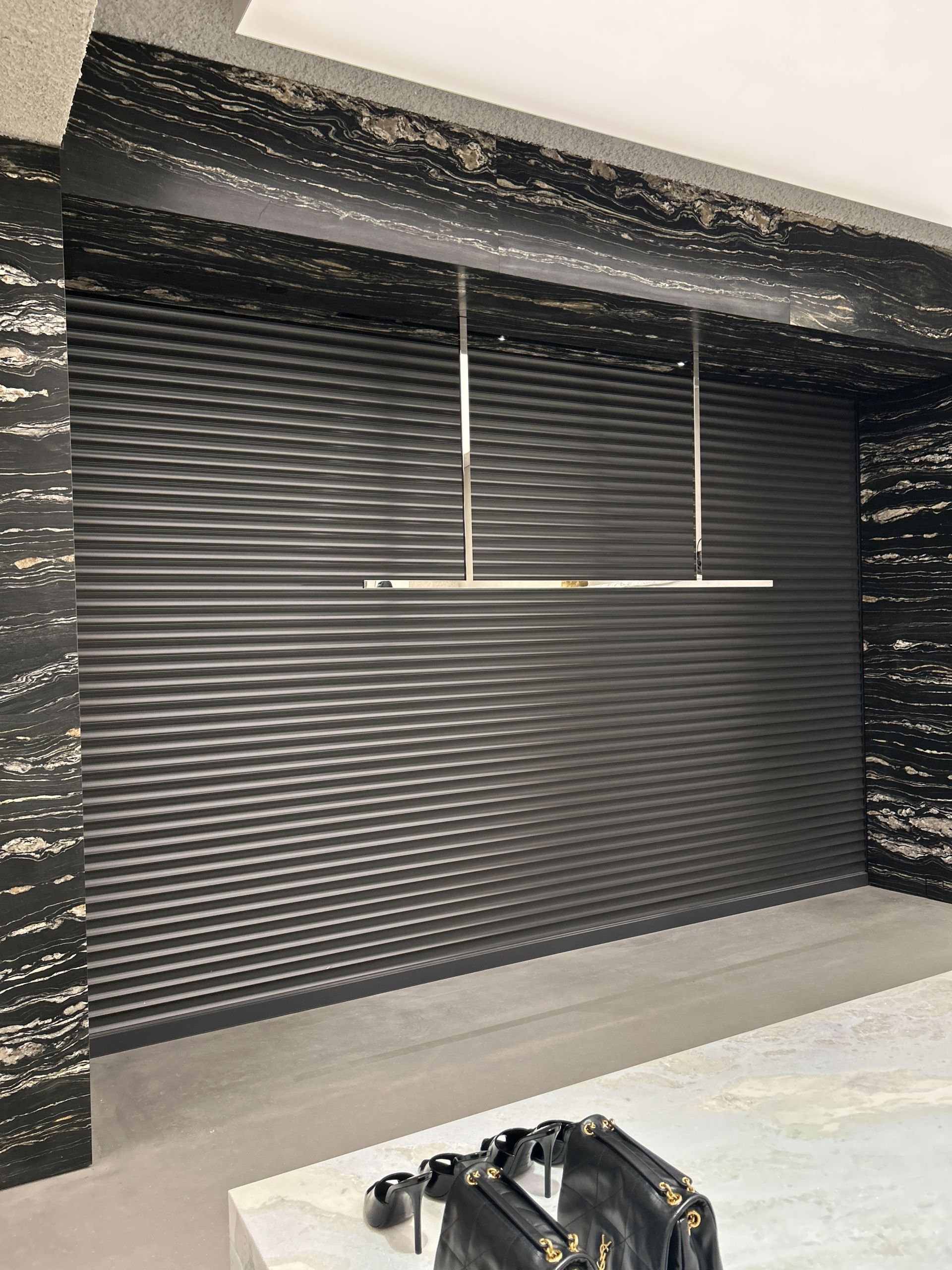 A room with a ceiling light hanging from the ceiling.