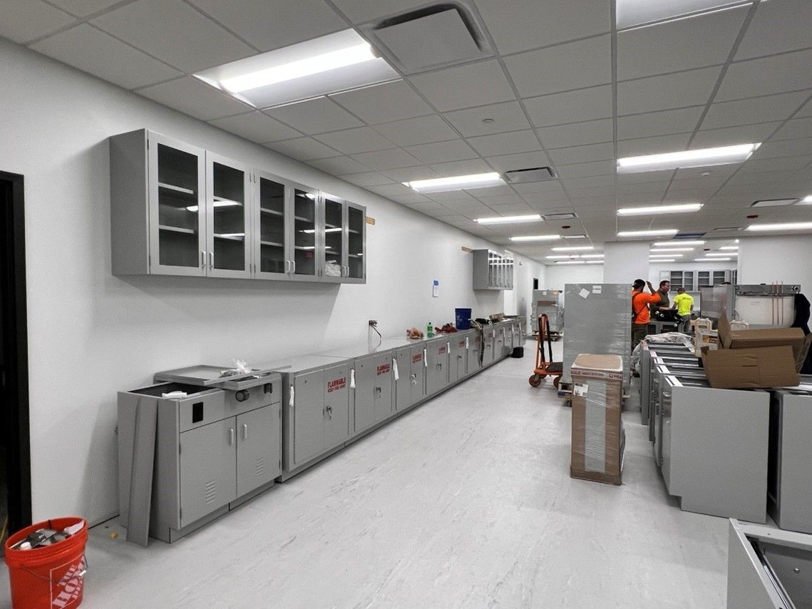 A large room with a lot of cabinets and boxes on the floor - Elgin, IL - Omni Commercial Group, Inc