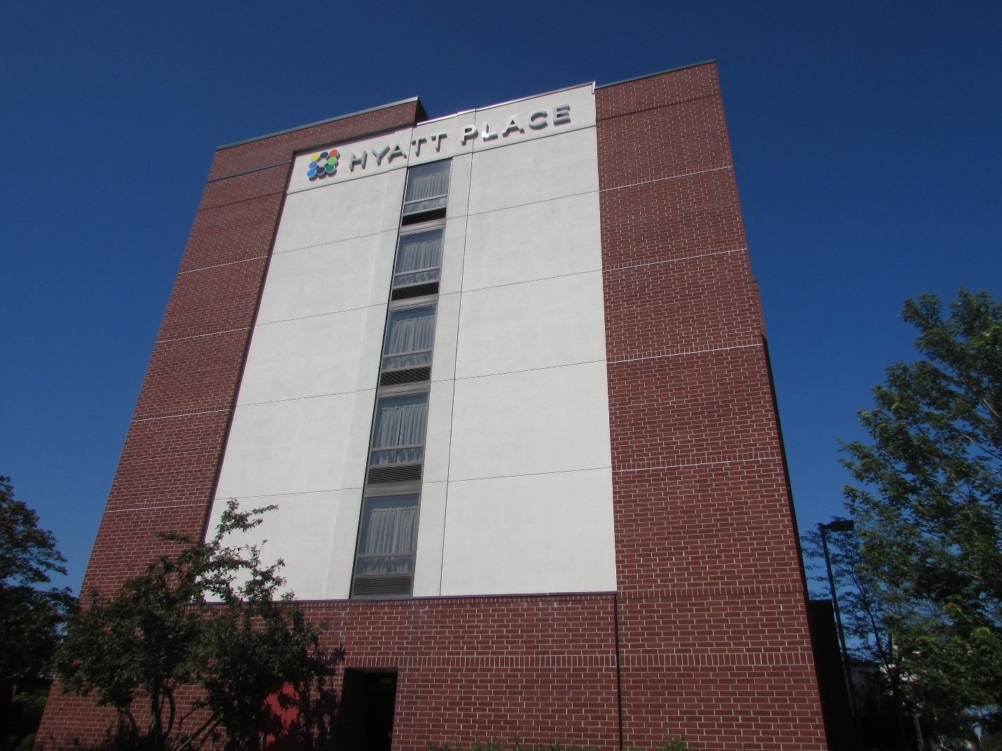 A large brick building with the word hyatt place on it