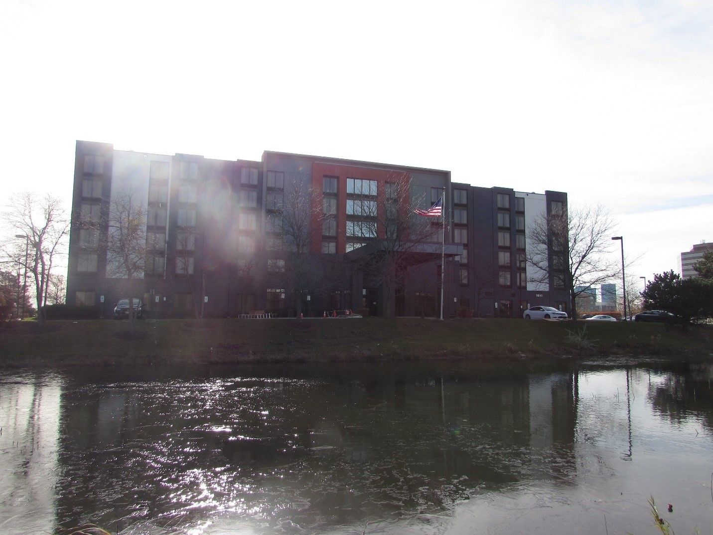 A large building with a parking lot in front of it