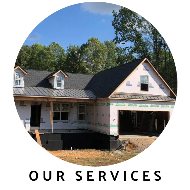 A circular photo of a house under construction with a white exterior, dark roof, and open garage, labeled 
