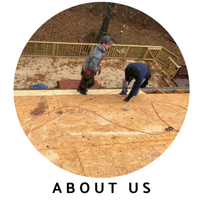 Two workers in work clothes installing plywood roof decking on a residential home.