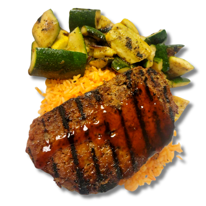 A plate of food with meat and vegetables on a white background