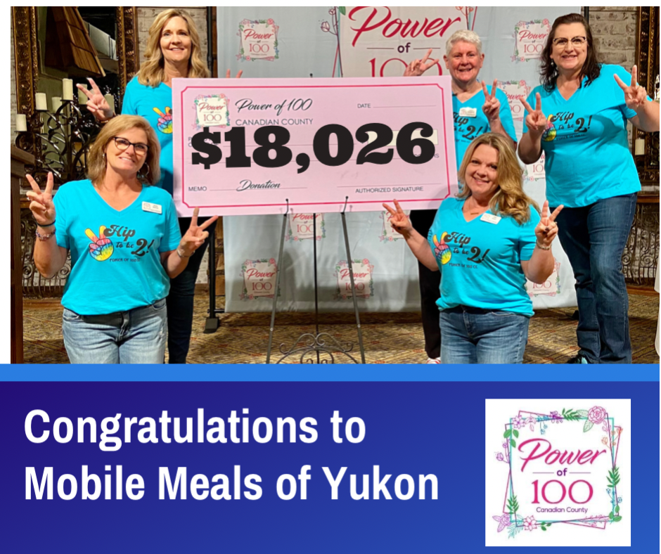 A group of women standing next to each other holding a check that says $ 18,026.