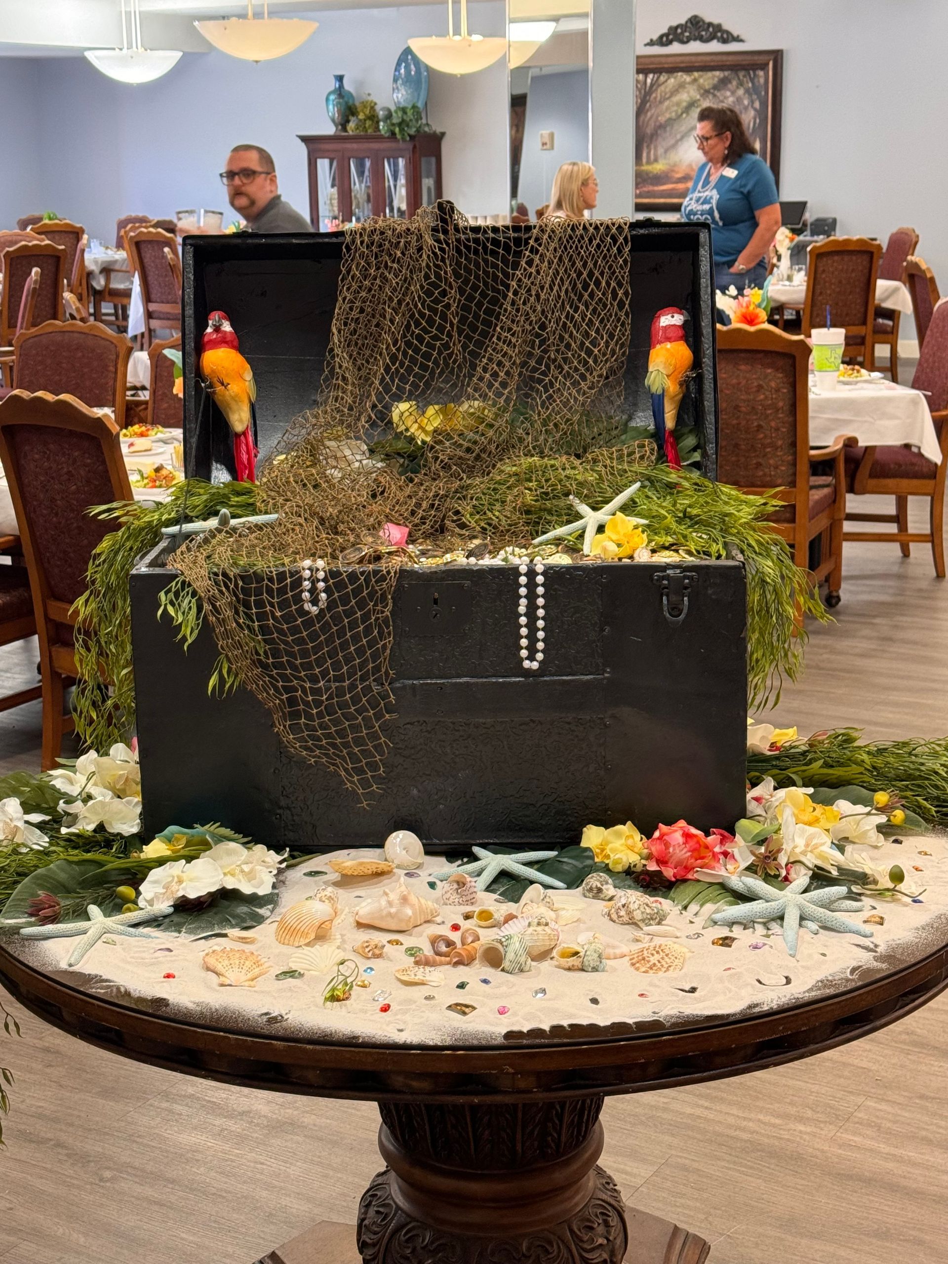 A table with a treasure chest on it in a restaurant