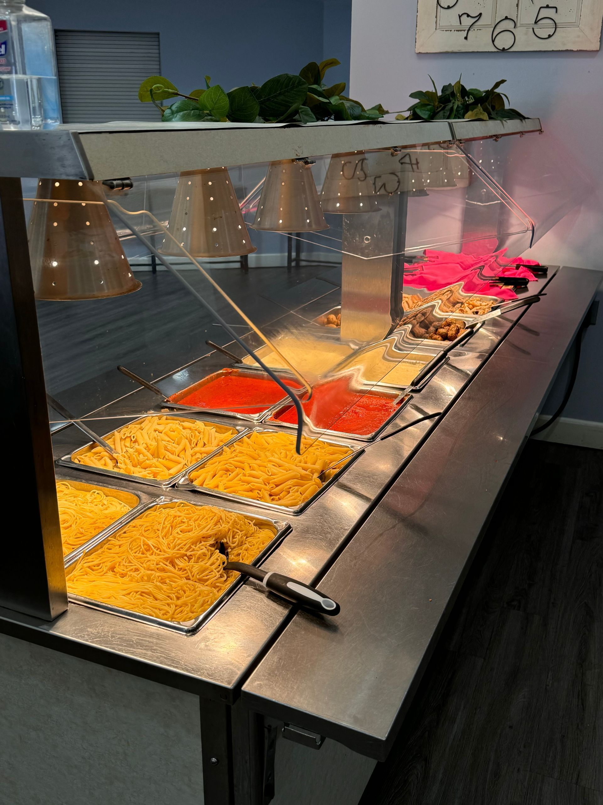 A buffet line with many different types of food