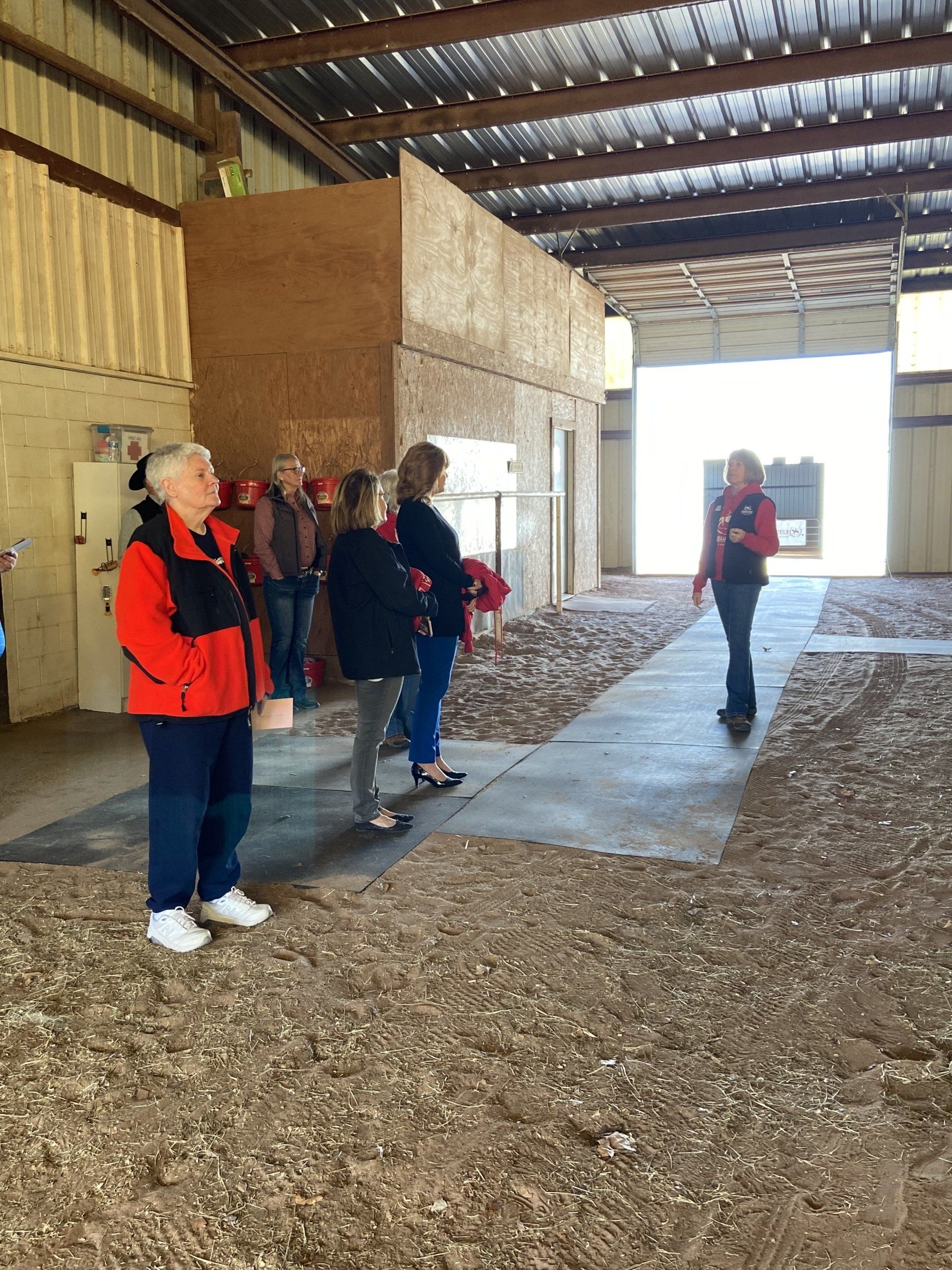 A group of people are standing inside of a building