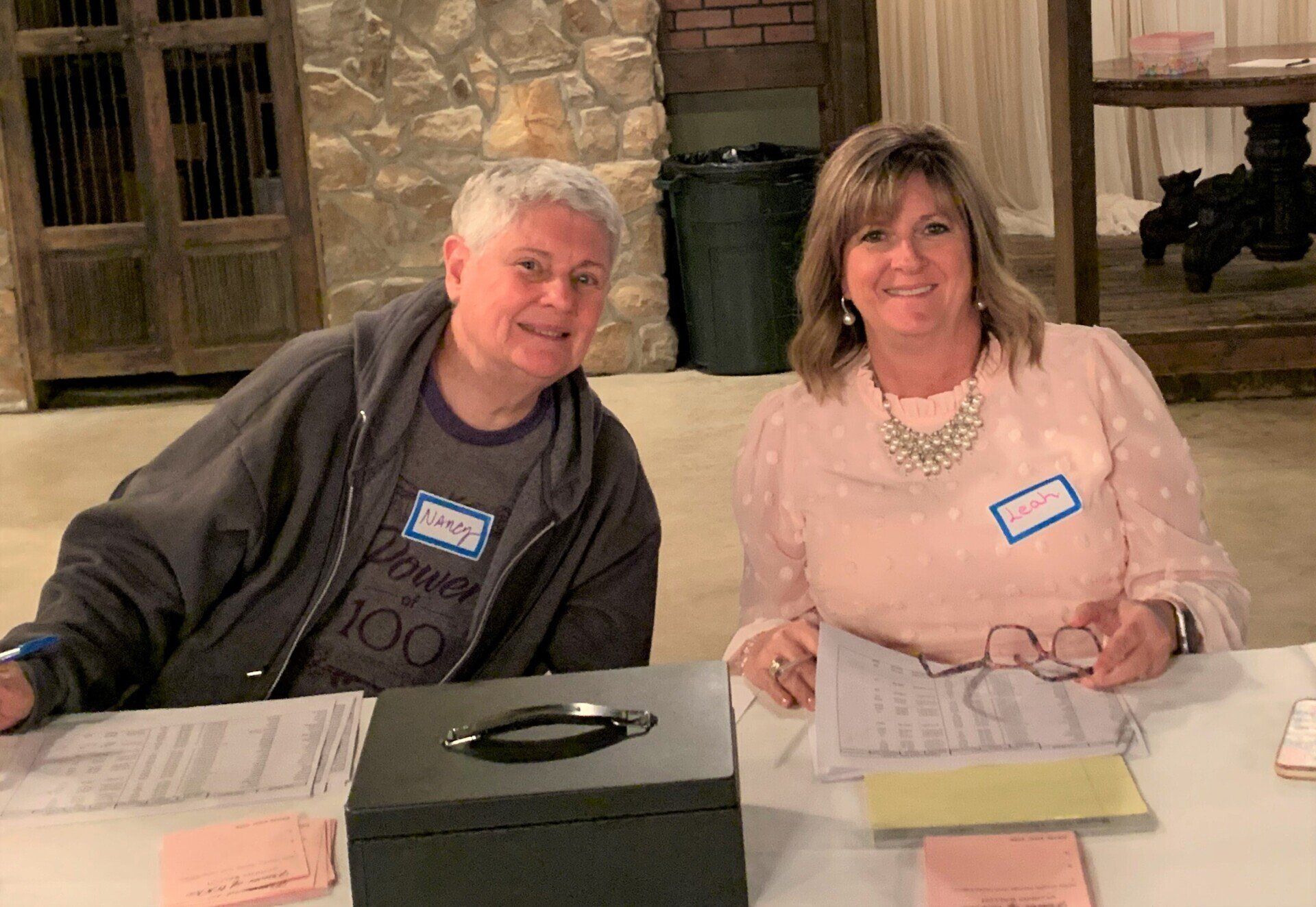 A man and a woman are sitting at a table.