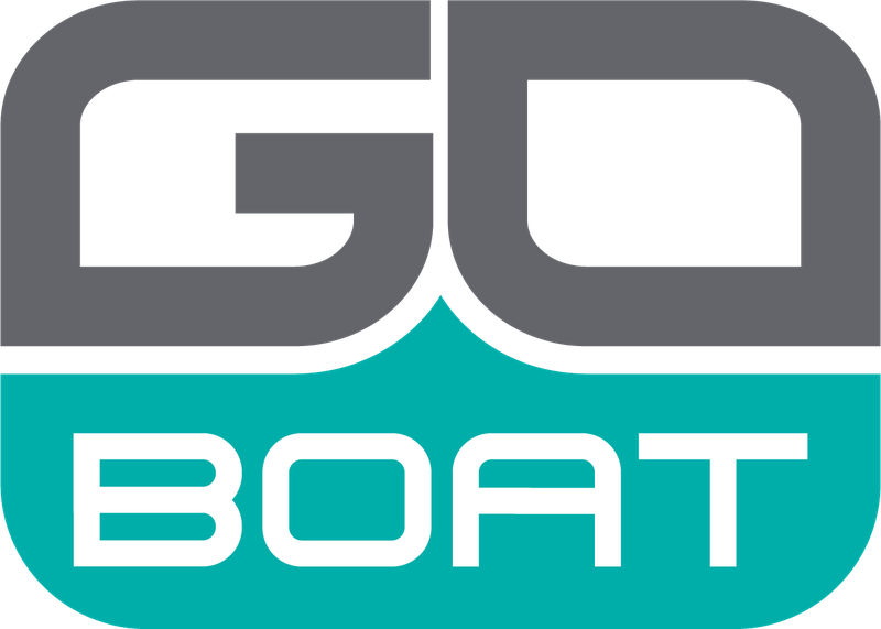 Five people ride in a white motorboat speeding across blue ocean water on a sunny day