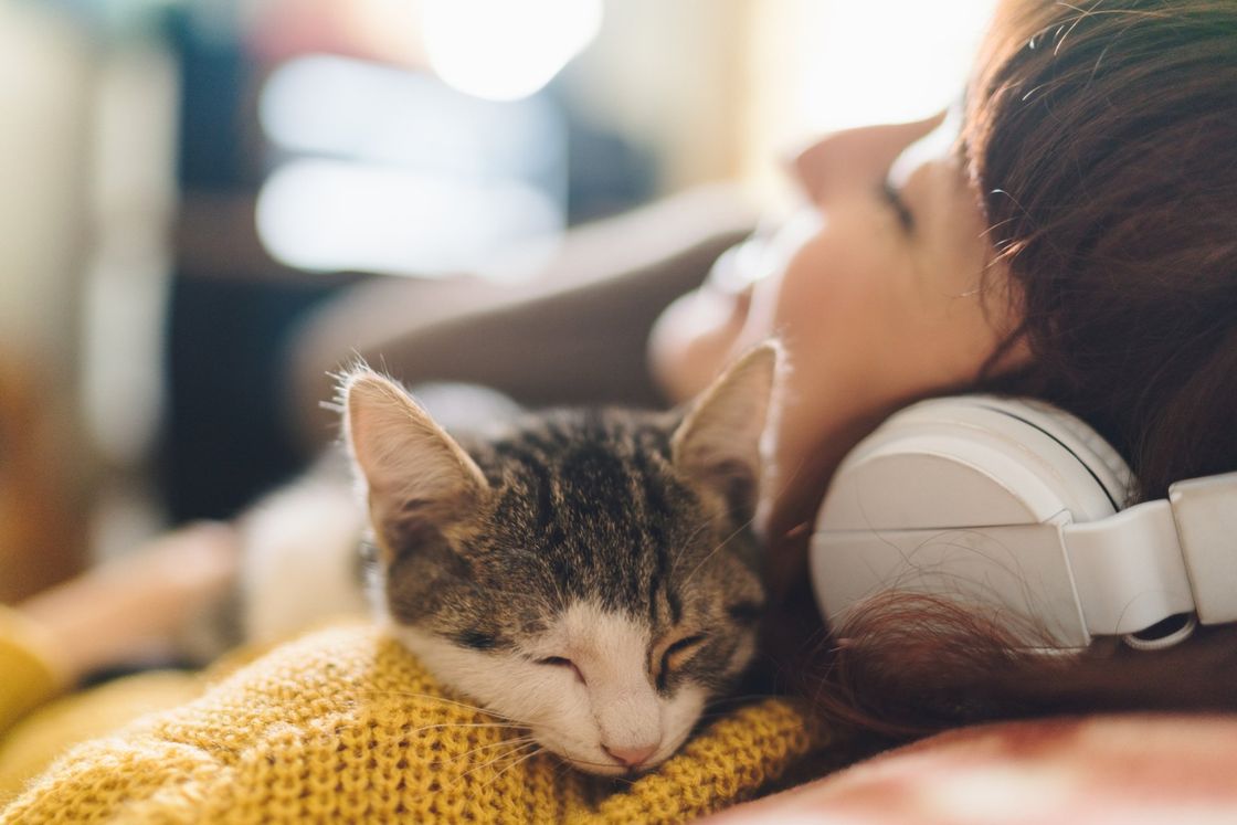 woman looking relaxed with cat