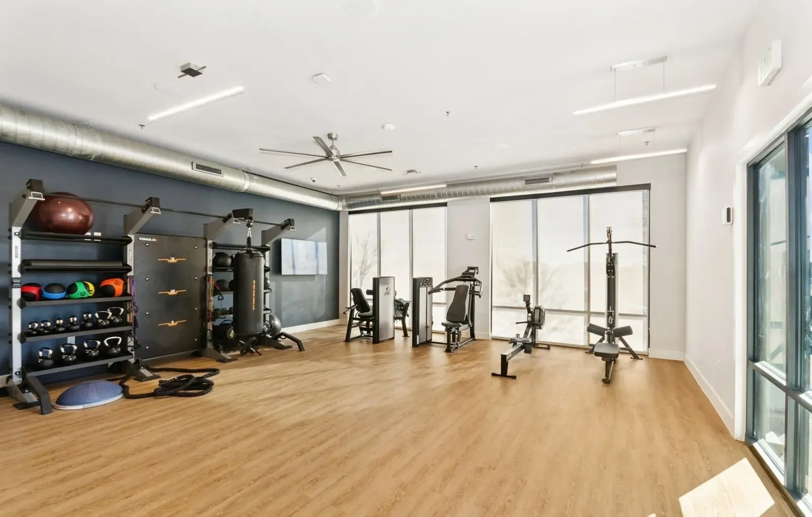 Well-lit community gym with cardio machines and free weights. Live connected at apartments near downtown Rowlett DART Blue Line—discover your commute-friendly home.