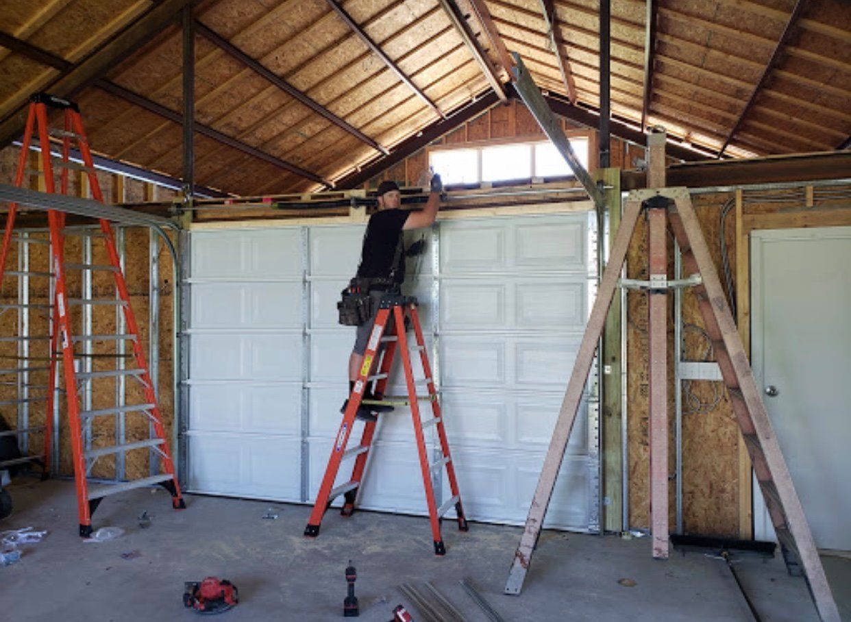 Man Working on a Garage — Portland, OR — Alpha Garage Doors