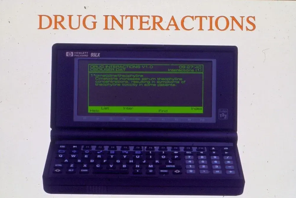 A laptop with a screen that says drug interactions