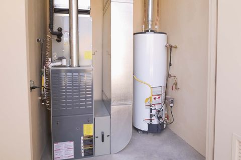 Heating Repair Services — Technician Servicing Heating Boiler in Utah Valley, UT