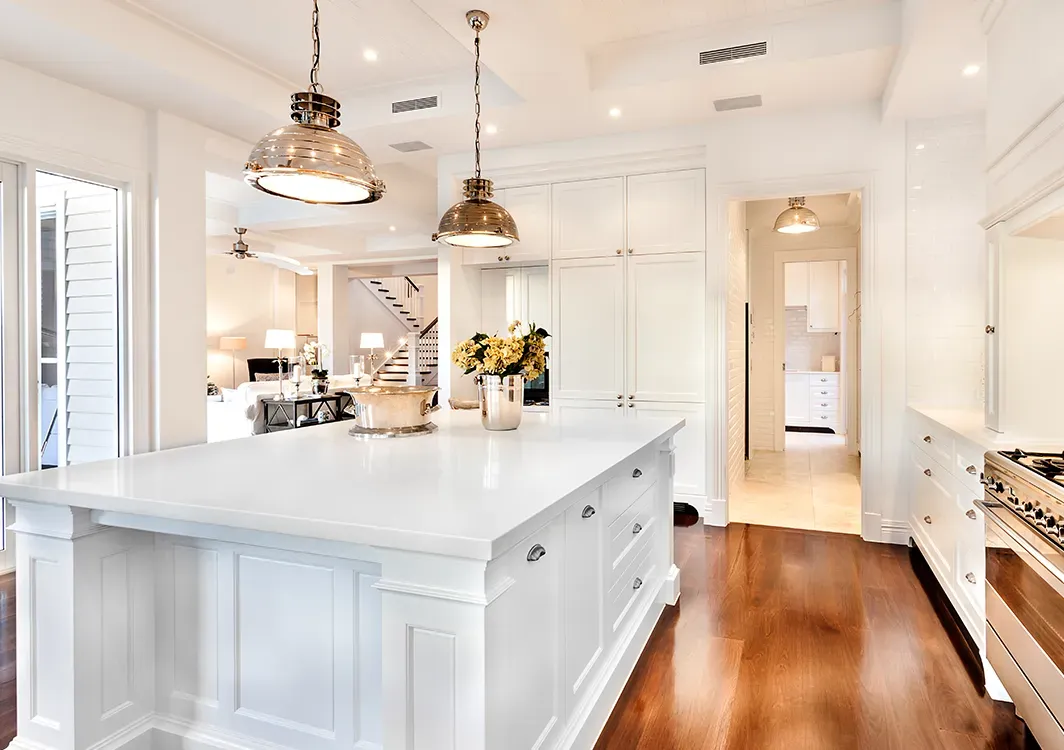 there is a large island in the middle of the kitchen .