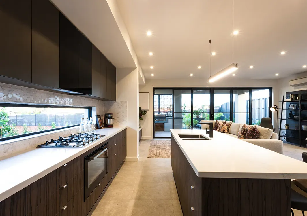 a kitchen with a large island in the middle of the room .