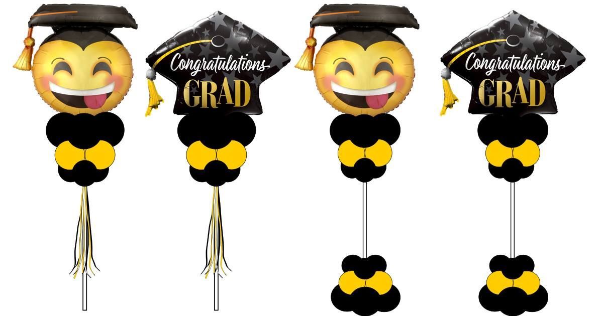 A set of four balloons with a graduation cap on them.