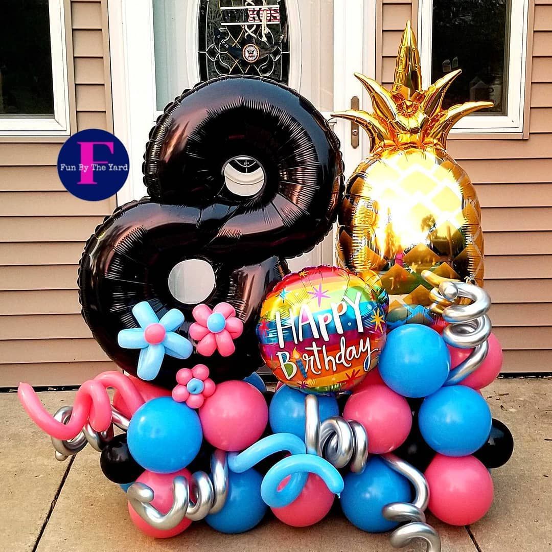 A bunch of balloons with the number 8 on it. Balloon Marquee
