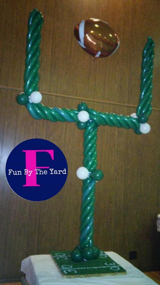A picture of a football goal post made out of balloons