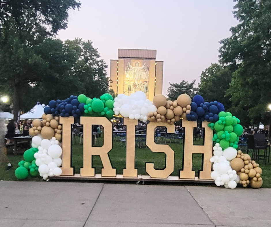 A large sign that says irish is decorated with balloons from Fun By The Yard at the University of Notre Dame