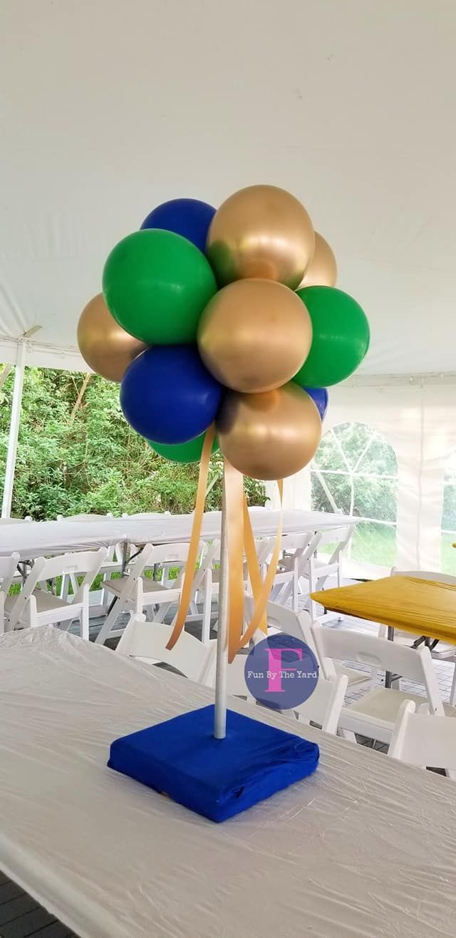 A bunch of balloons are sitting on top of a table.