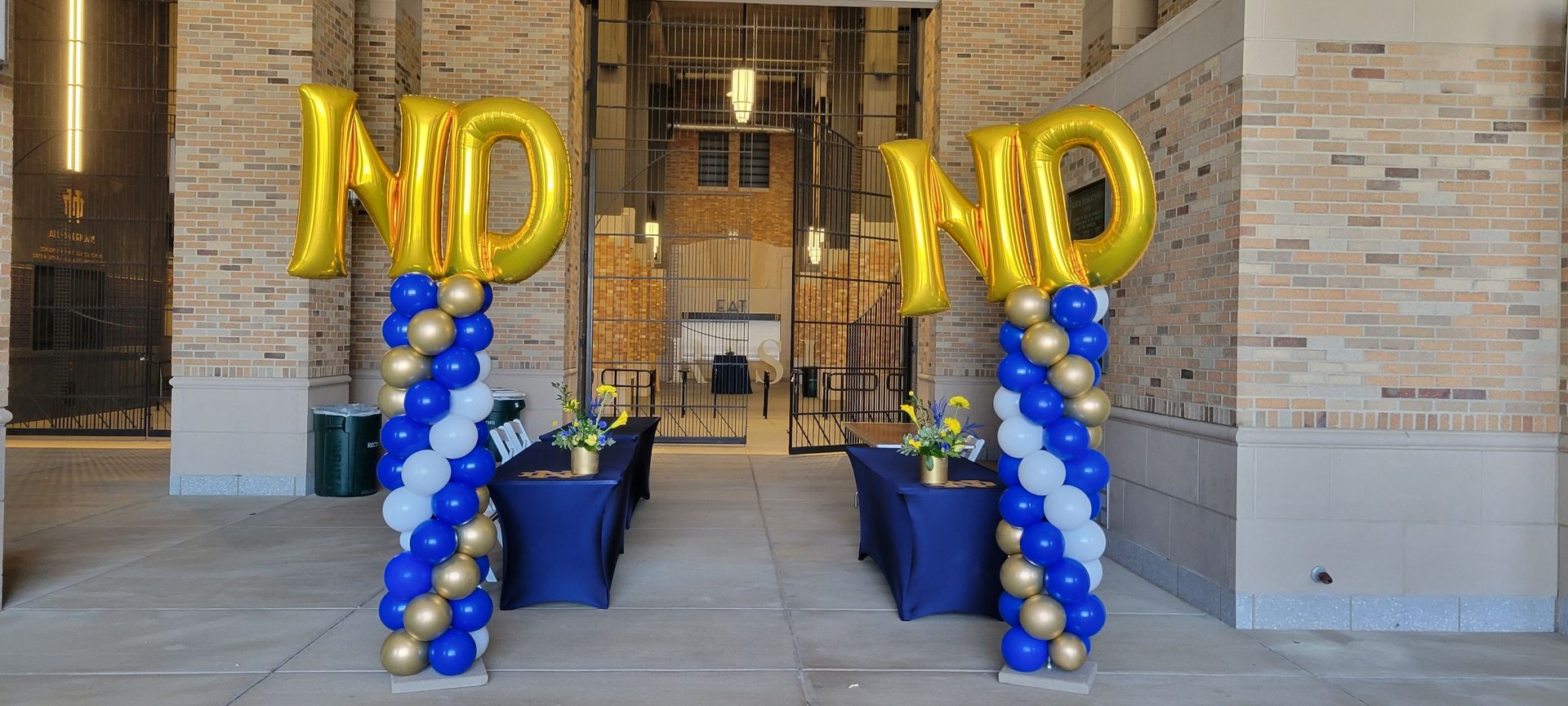 A couple of balloon columns with ND on top