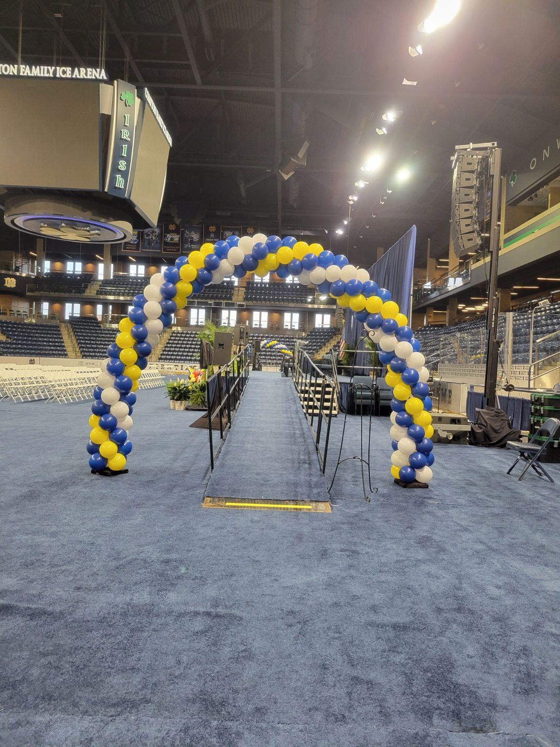 A blue and yellow balloon arch for graduation at the Compton Center University of Notre Dame