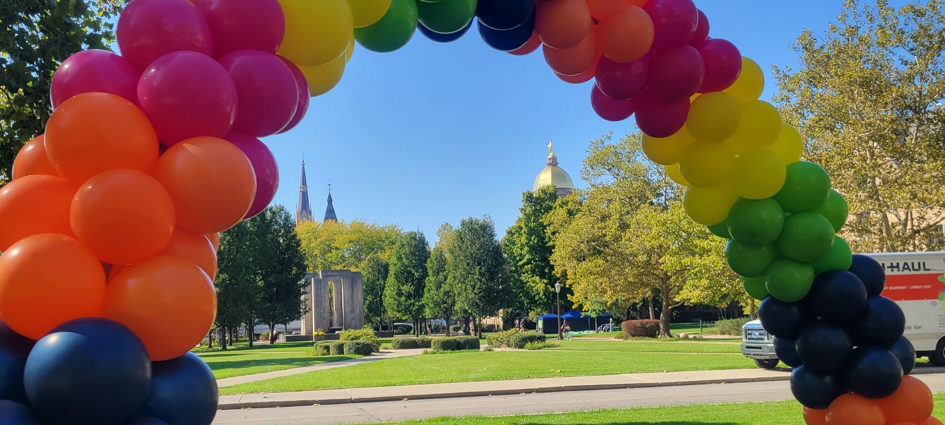 Rainbow balloon arch at Notre Dame