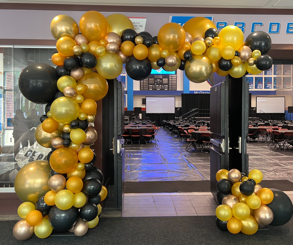 Freeform balloon garland half arch in gold and black
