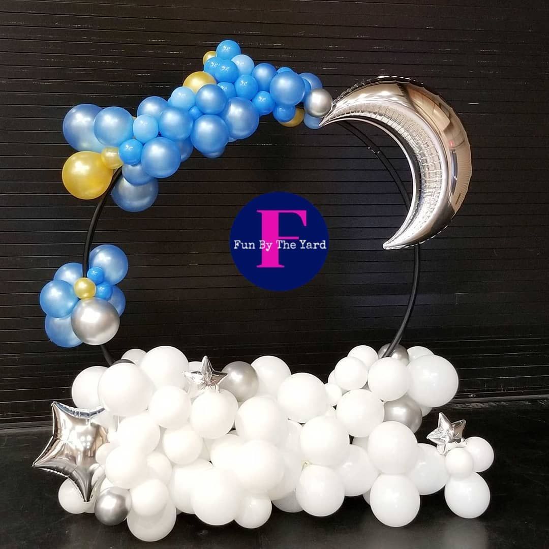 over the moon baby shower photo op with moon and stars