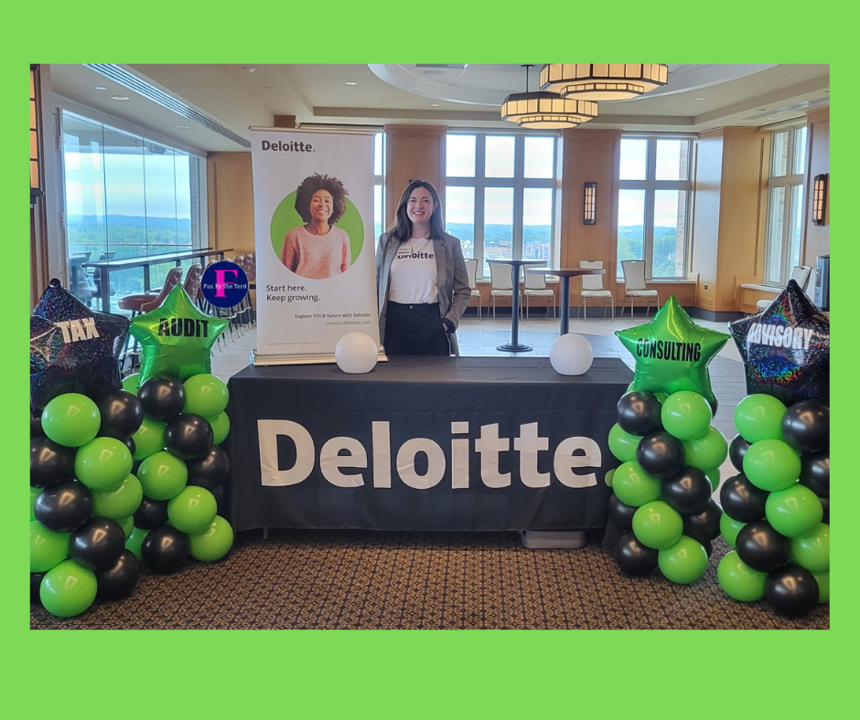 Woman stands at a Deloitte booth with balloons; tax, audit, and consulting promotion in a room with a view.