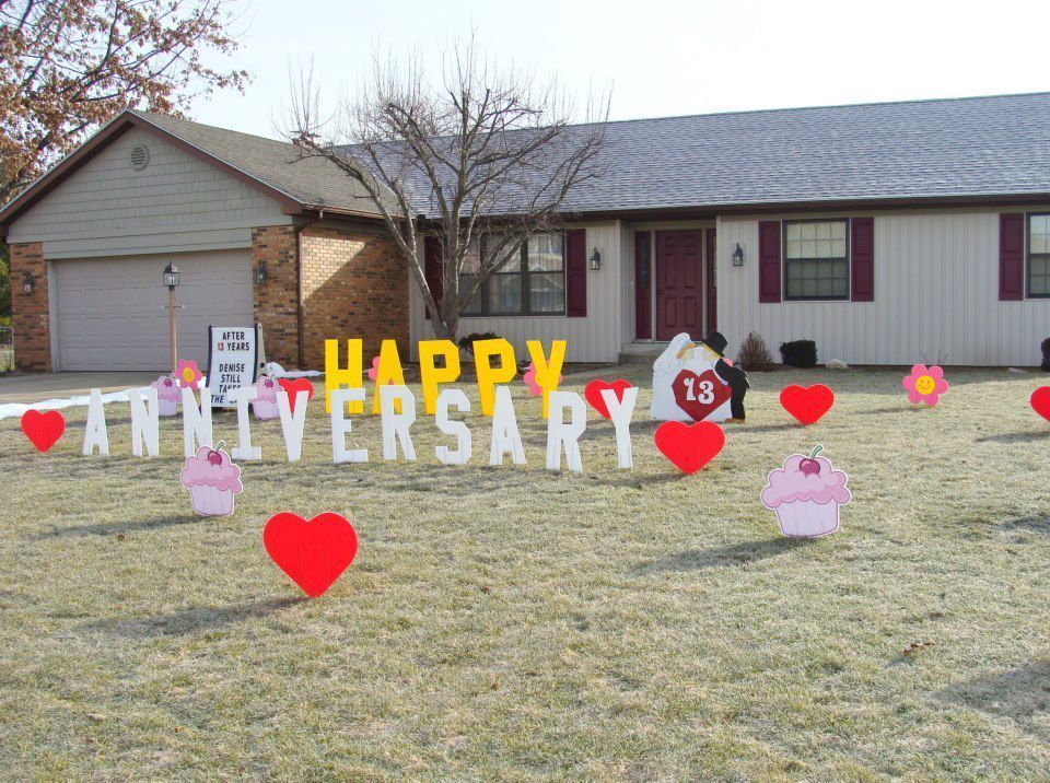 A happy anniversary sign in front of a house